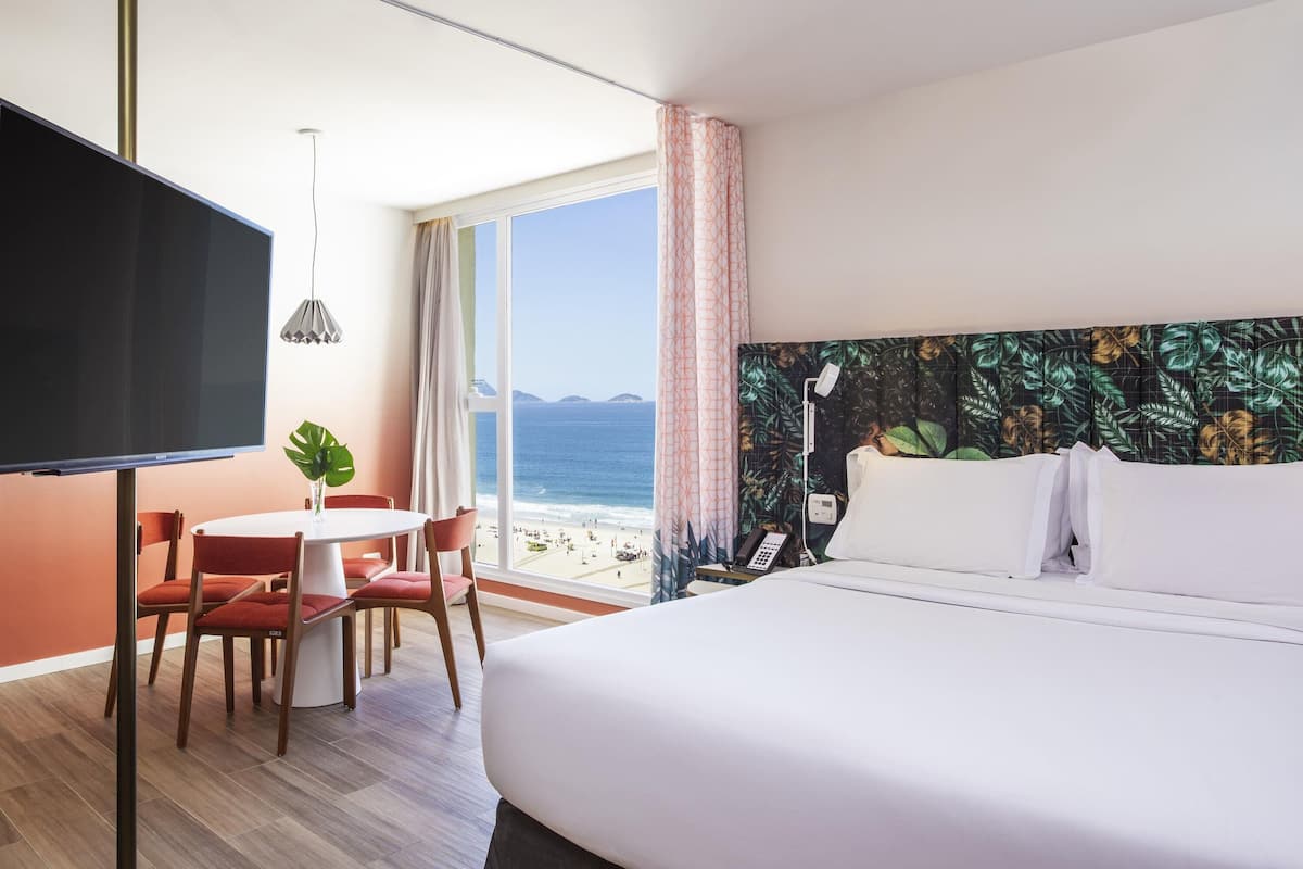 Junior Suite, 1 Queen Bed, Sea View | Minibar, in-room safe, desk, blackout drapes