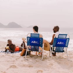 On the beach, white sand, beach umbrellas, beach towels