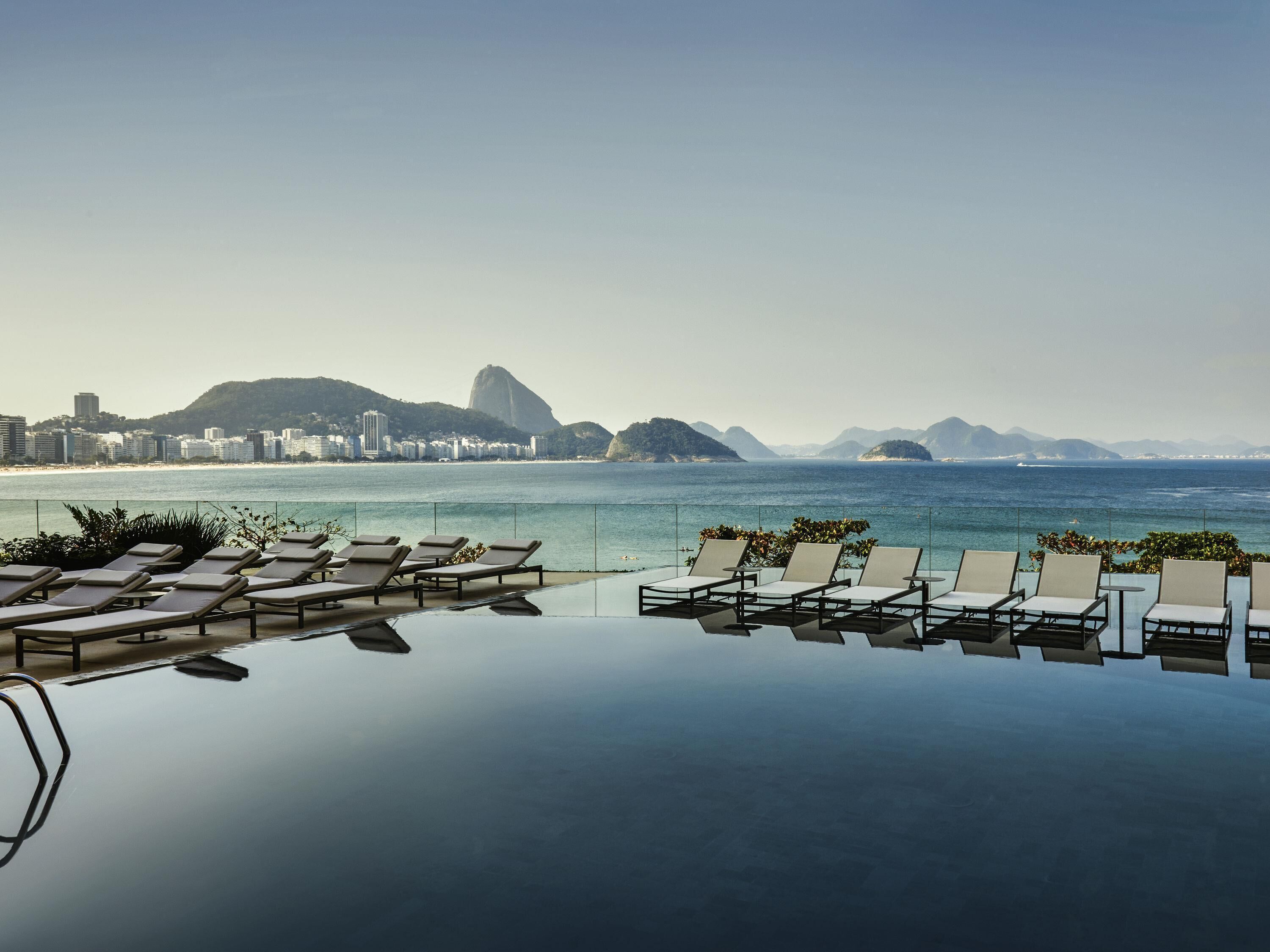 2 outdoor pools, open 7:00 AM to 6:00 PM, pool umbrellas, pool loungers