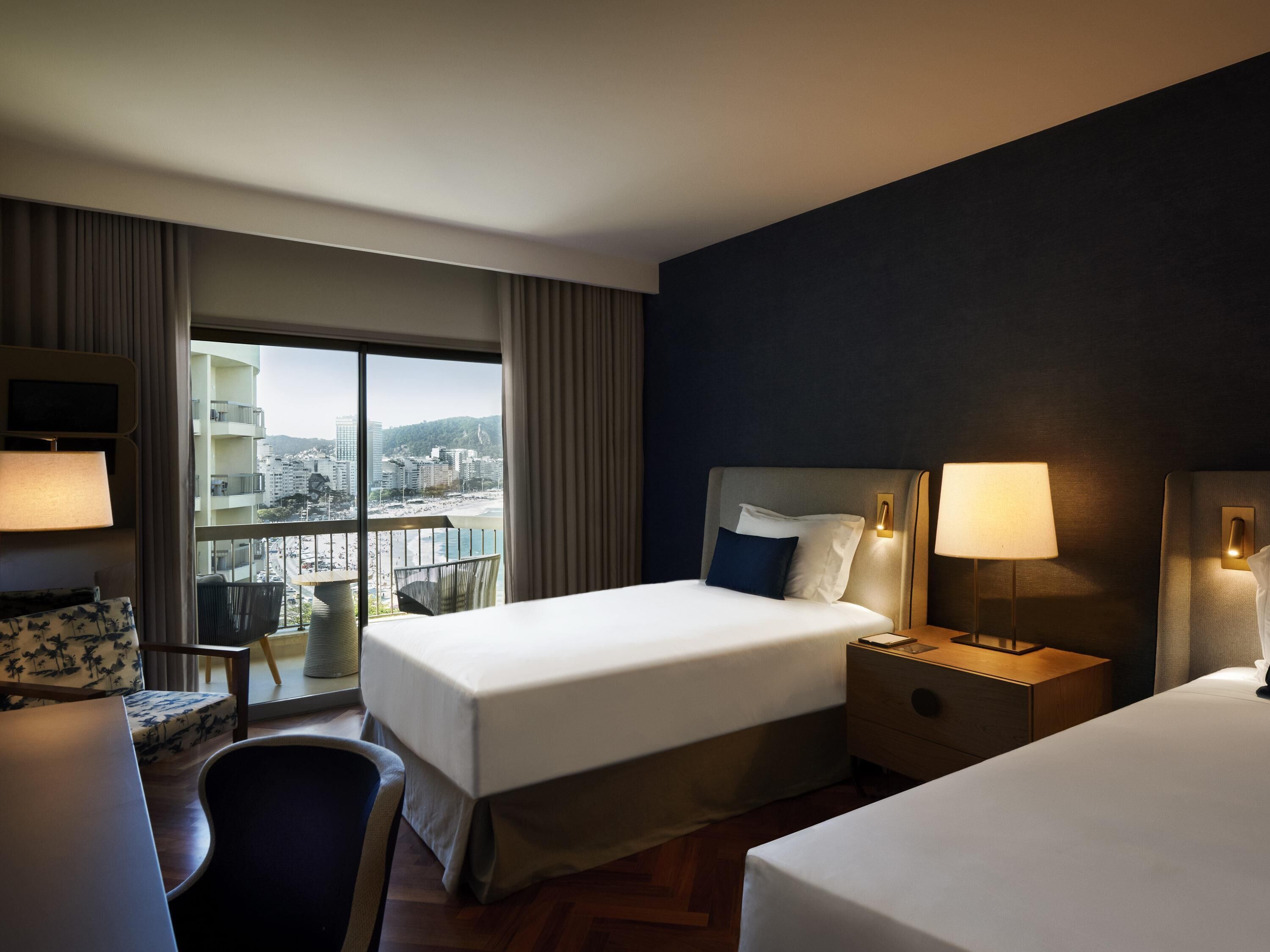 Deluxe Room, 2 Twin Beds, Sea View | Minibar, in-room safe, soundproofing, iron/ironing board