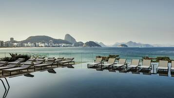 2 outdoor pools, open 7:00 AM to 6:00 PM, pool umbrellas, sun loungers