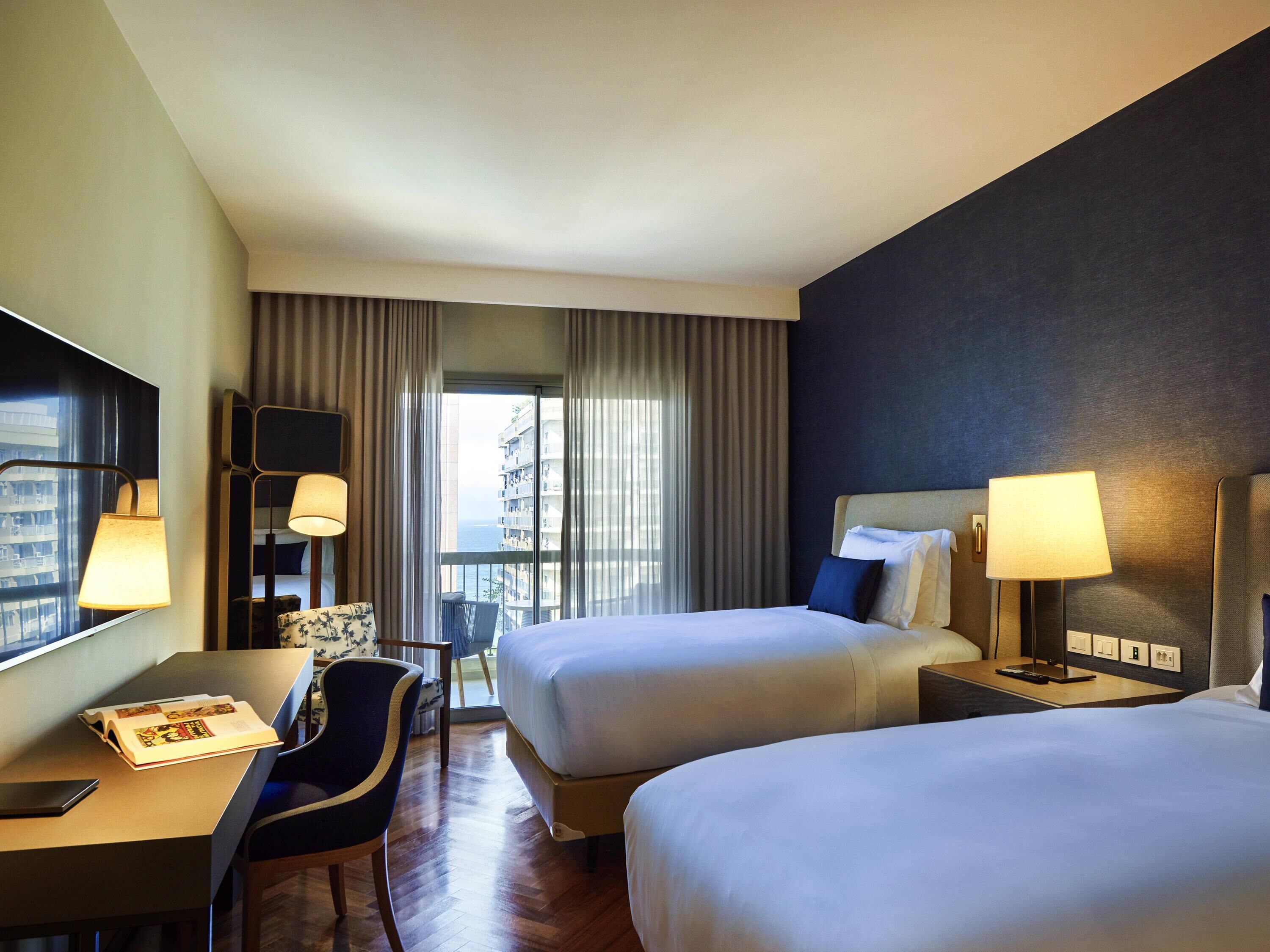 Deluxe Room, 2 Twin Beds, City View | Minibar, in-room safe, soundproofing, iron/ironing board