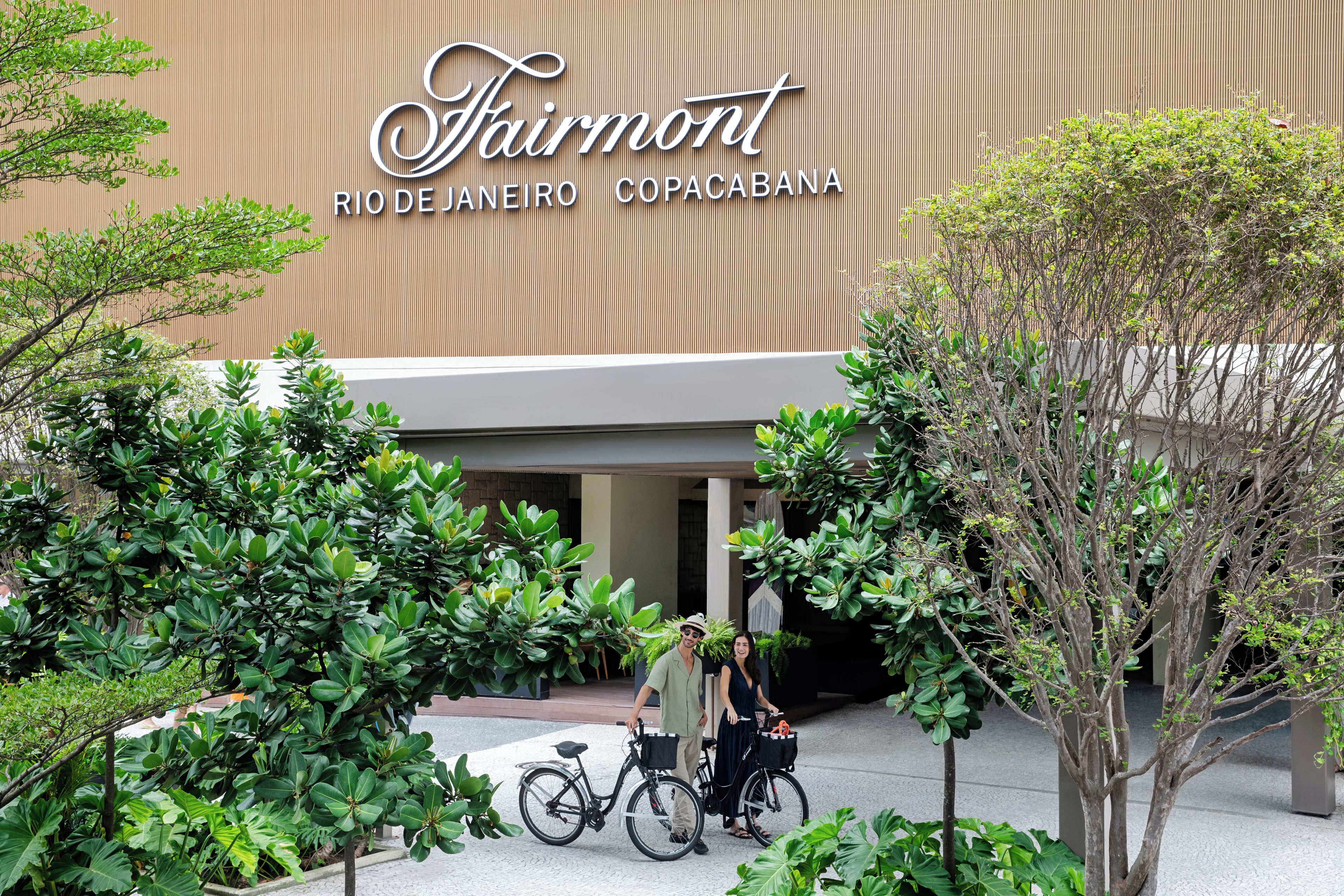 A hotel entrance with a sign reading 'Fairmont Rio de Janeiro Copacabana'.