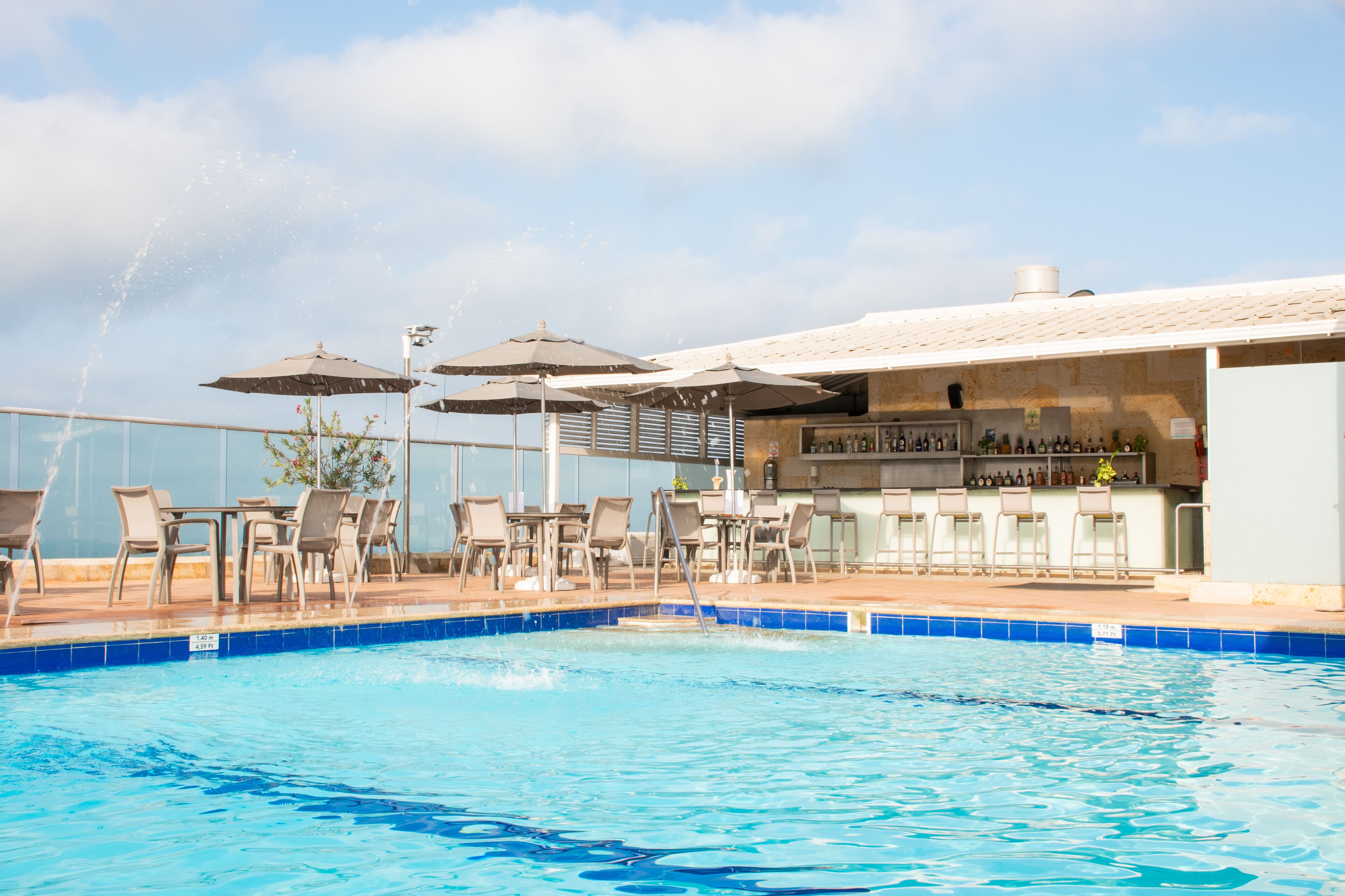 outdoor pool, open 10:00 am to 7:00 pm, pool umbrellas, pool loungers