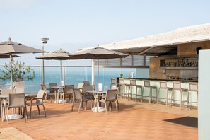 Outdoor pool, open 10:00 AM to 7:00 PM, pool umbrellas, pool loungers