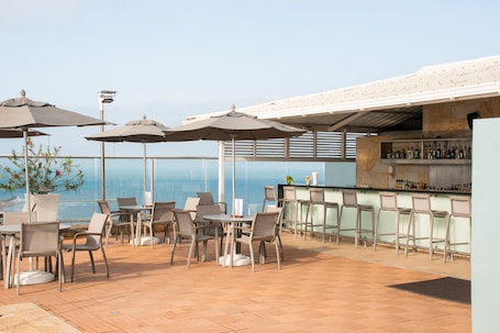 Outdoor pool, open 10:00 AM to 7:00 PM, pool umbrellas, sun loungers