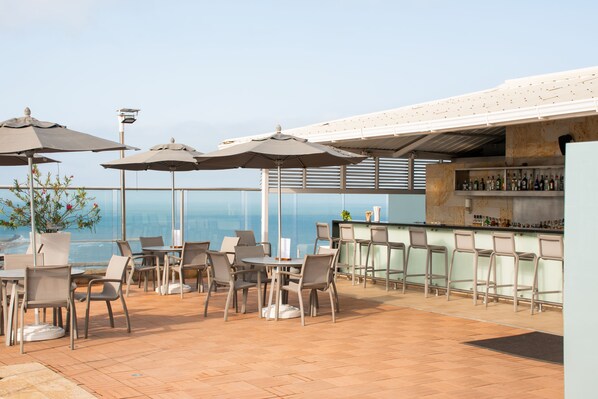 Outdoor pool, open 10:00 AM to 7:00 PM, pool umbrellas, sun loungers