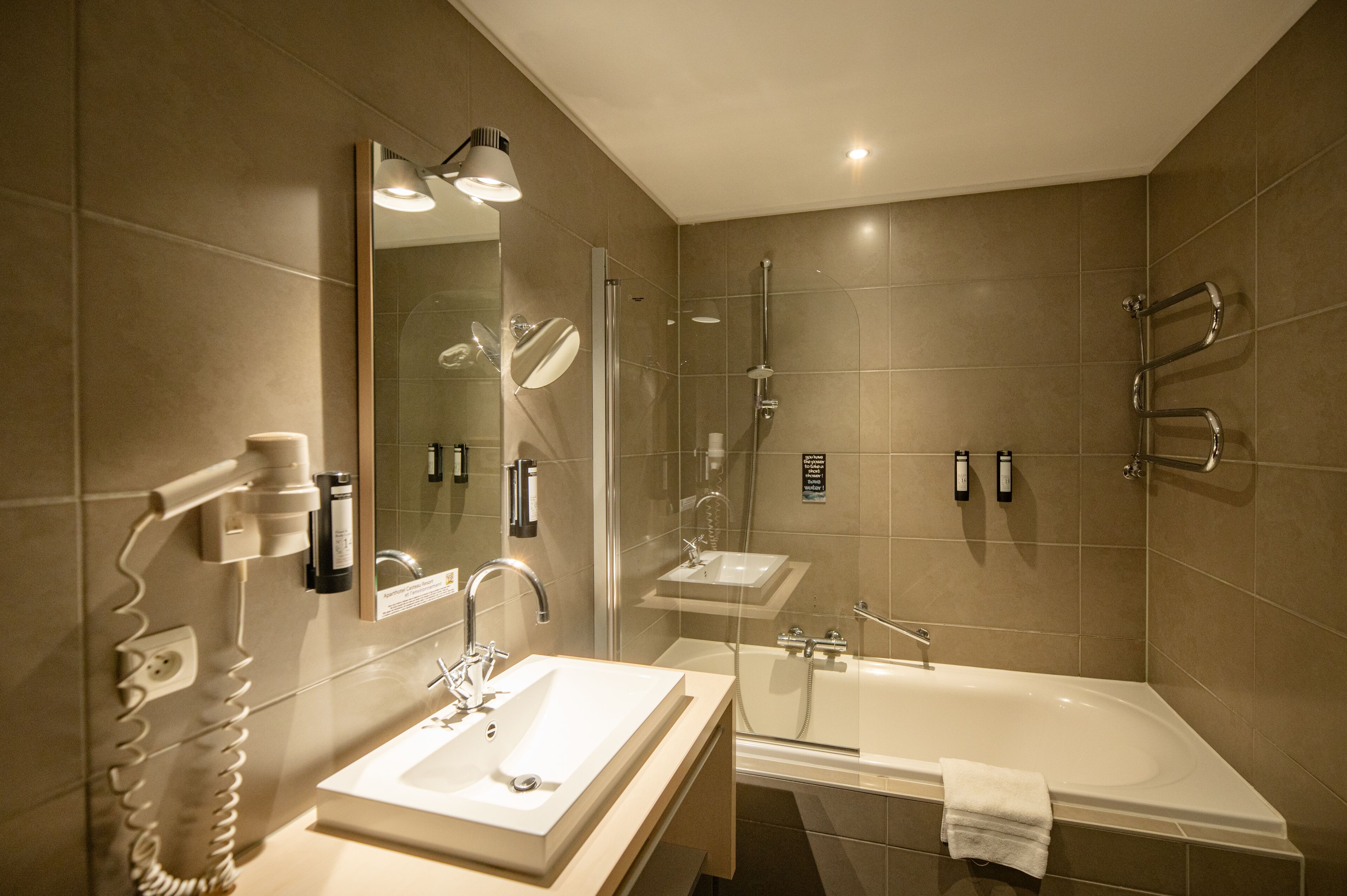 combined shower/bathtub, free toiletries, hair dryer, towels