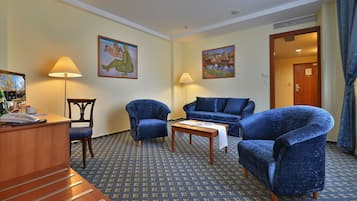 Suite, 1 King Bed, Non Smoking | Living area | 26-inch flat-screen TV with satellite channels, TV