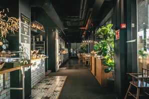 A restaurant interior with a reception desk, a visible menu, and a seating area with tables and chairs. - Original Sokos Hotel Koljonvirta (Iisalmi)