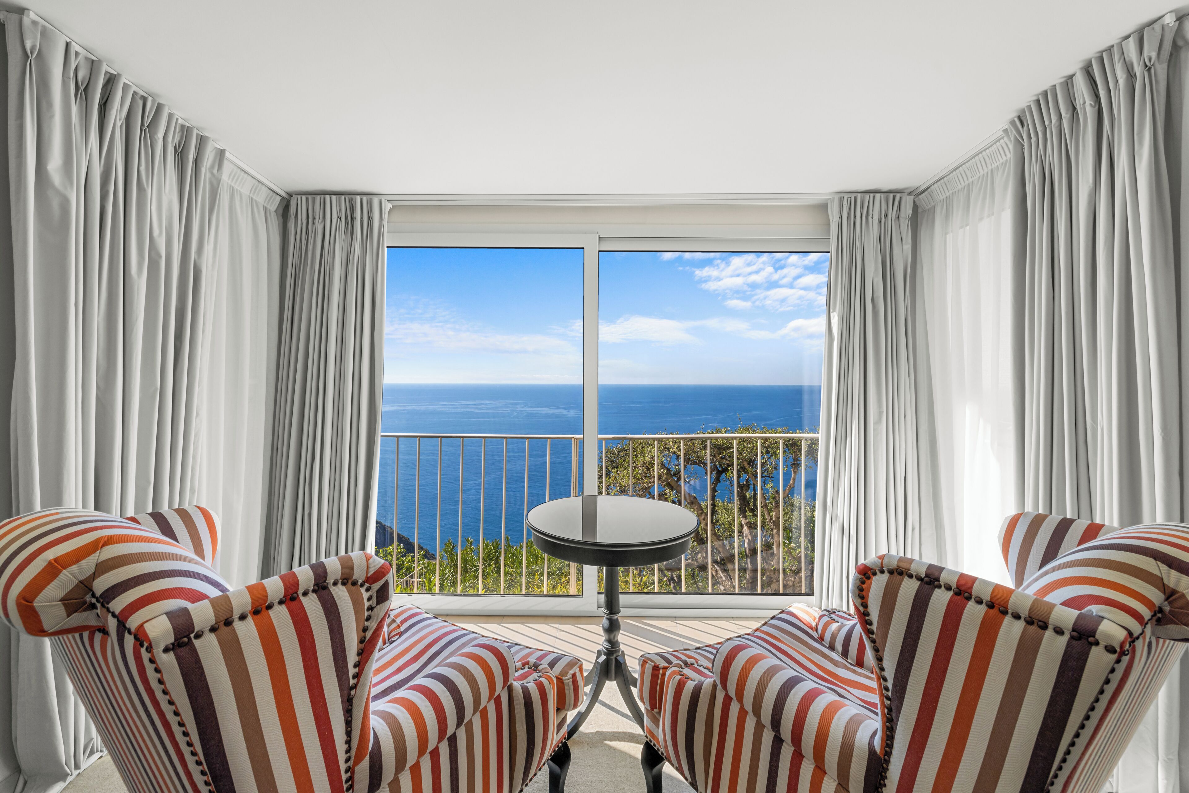 junior suite, 1 bedroom, sea view | living area | tv, ipod dock