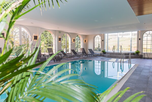 Indoor pool, seasonal outdoor pool, pool umbrellas, pool loungers