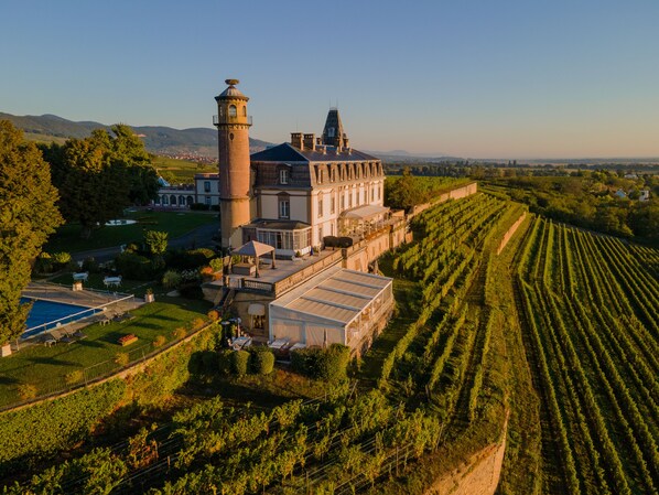Experience the grandeur of this estate, surrounded by beautifully landscaped gardens and vineyards.