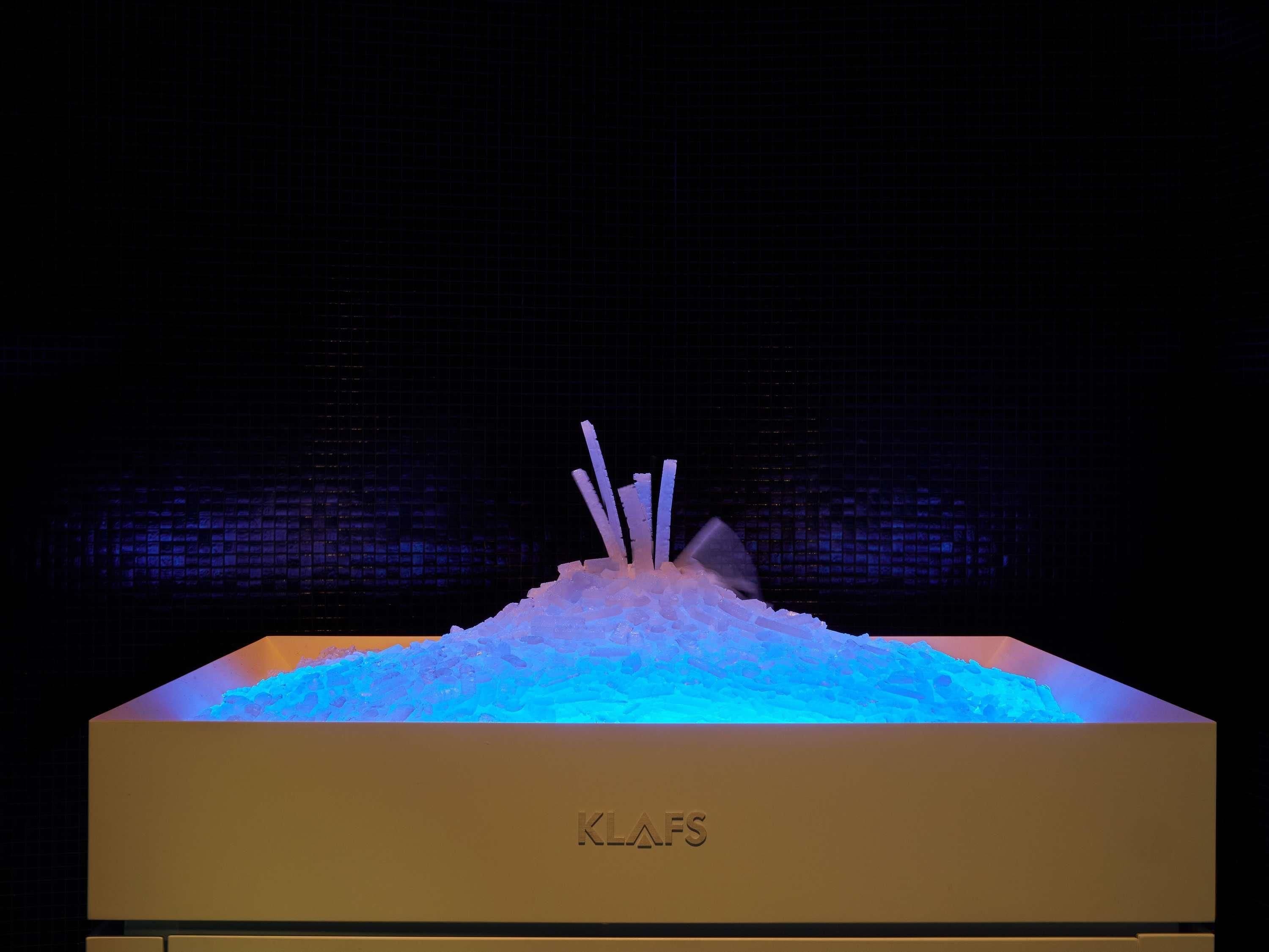 A display case with a textured surface and the text 'KLAFS' on it.