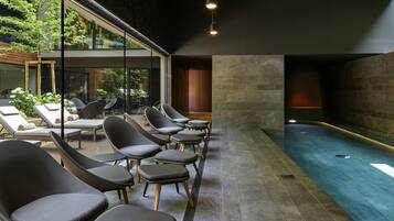 Indoor pool, open 8:00 AM to 8:00 PM, pool loungers