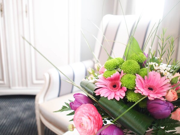 A bouquet of flowers on a chair.