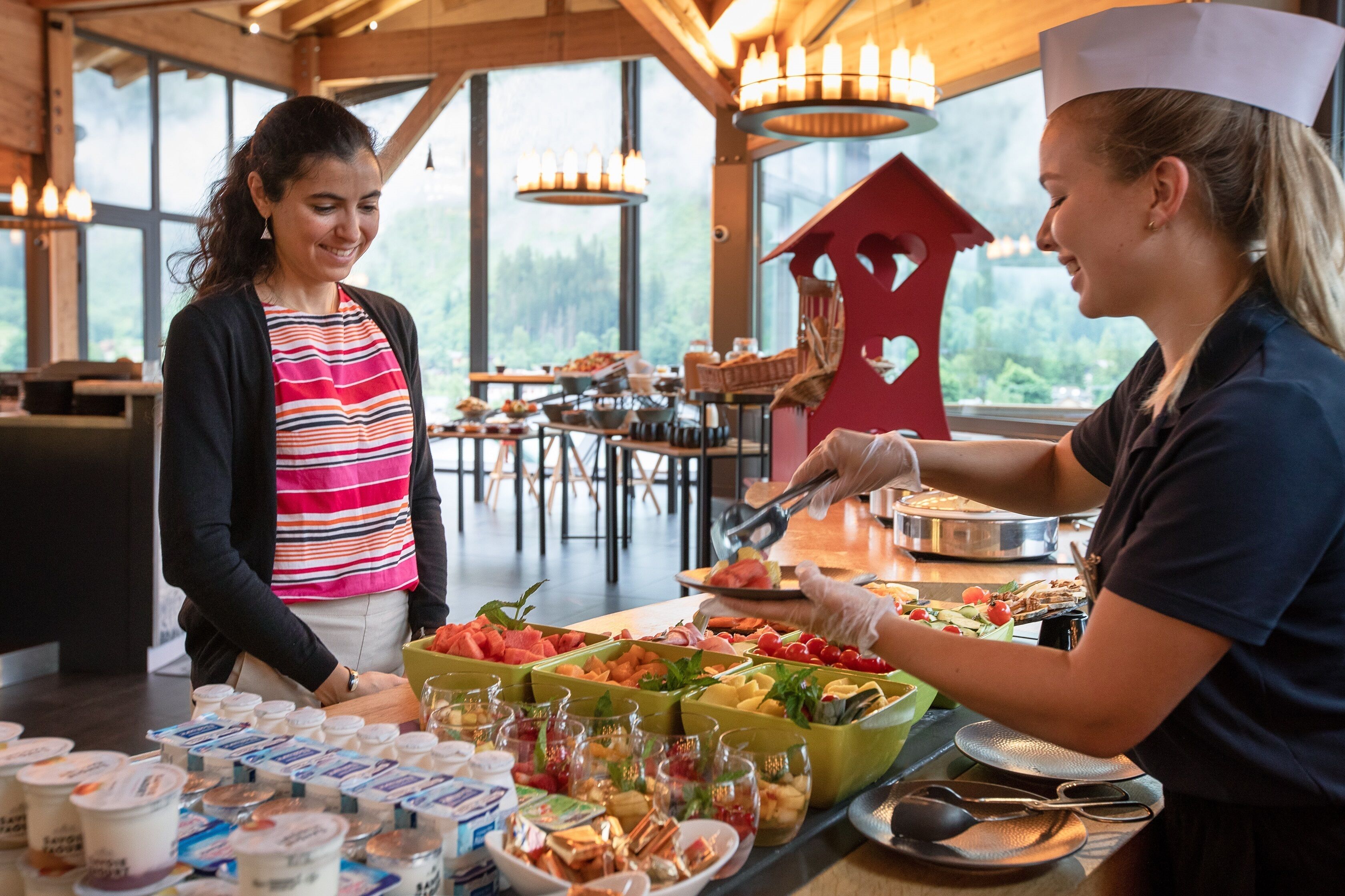 A buffet setup with various food items and beverages.