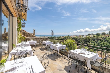 Regional cuisine, alfresco dining . Chateau Le Cagnard