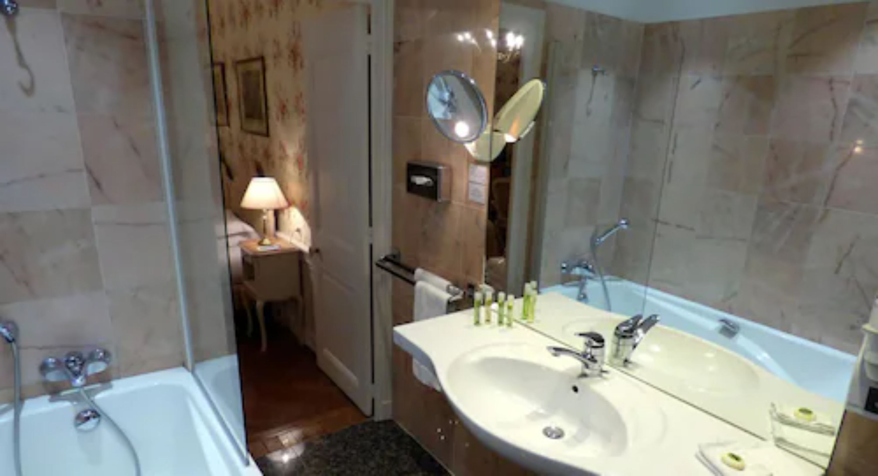 combined shower/bathtub, designer toiletries, hair dryer, bathrobes