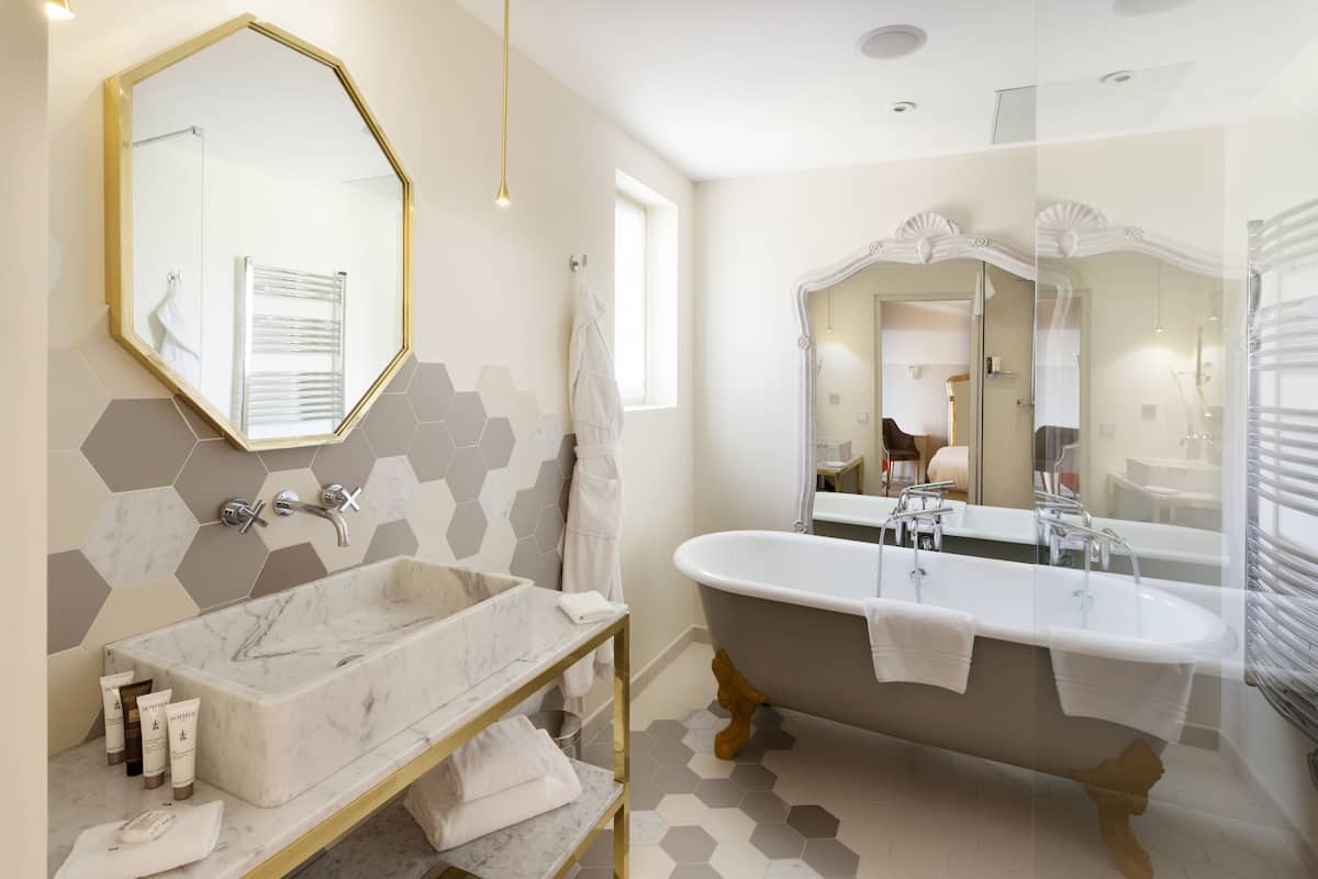 junior suite | bathroom | designer toiletries, hair dryer, bathrobes, slippers
