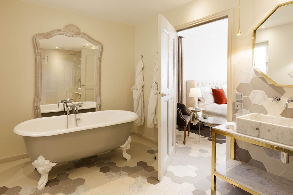 designer toiletries, hair dryer, bathrobes, slippers