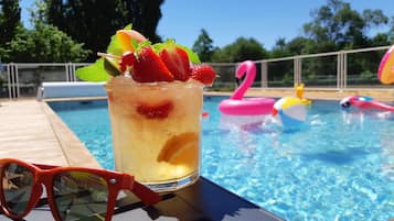Seasonal outdoor pool, open 9:00 AM to 9:00 PM, pool loungers