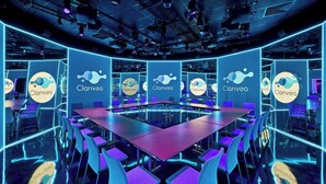 A modern conference room with a long table and purple chairs, surrounded by walls with 'Clarivea' branding. - Paris Marriott Rive Gauche Hotel & Conference Center (Paris)