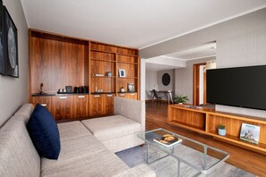 65-inch TV with satellite channels, pay movies