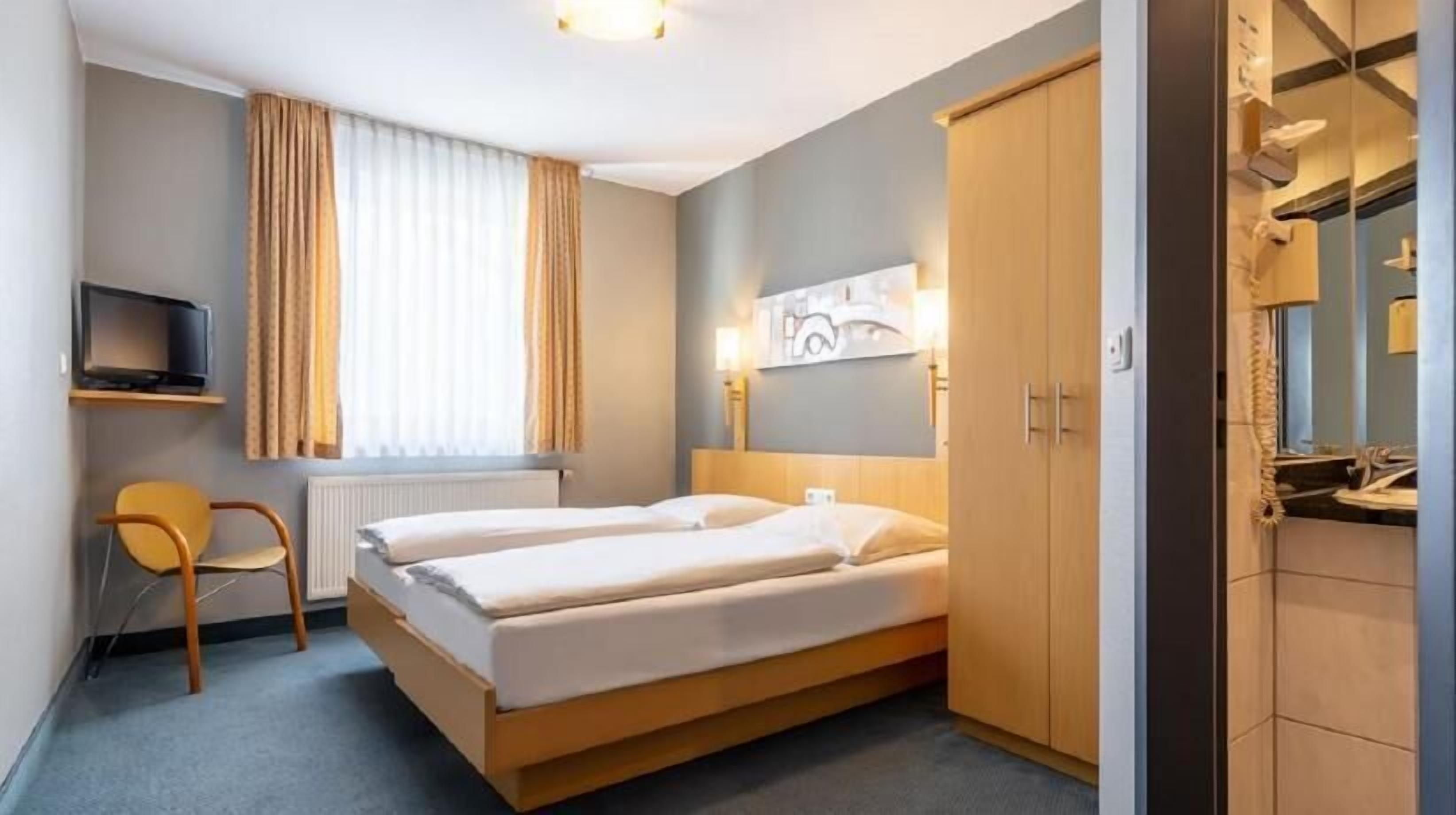 Premium bedding, blackout curtains, iron/ironing board, free WiFi