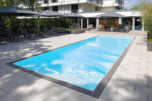 Outdoor pool, pool umbrellas, pool loungers