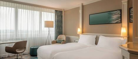 Hypo-allergenic bedding, down duvets, pillow-top beds, minibar