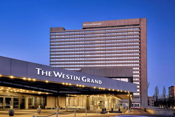 The Westin Grand hotel with a modern facade, large windows, and a prominent entrance area. - The Westin Grand Munich (Munich)