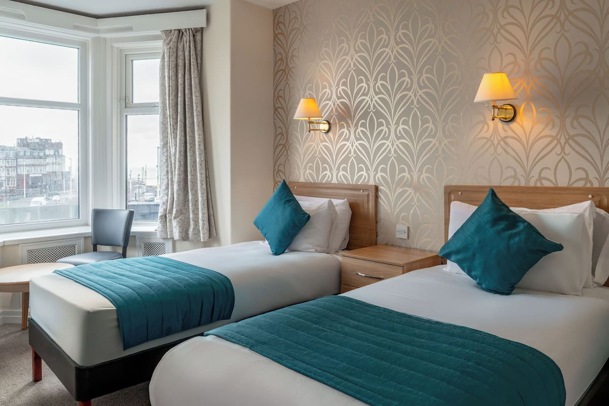 Twin Room, Sea View | In-room safe, desk, iron/ironing board (on request), free WiFi