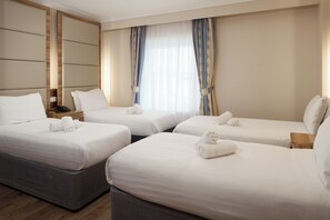 Standard Quadruple Room | In-room safe, desk, iron/ironing board, free WiFi
