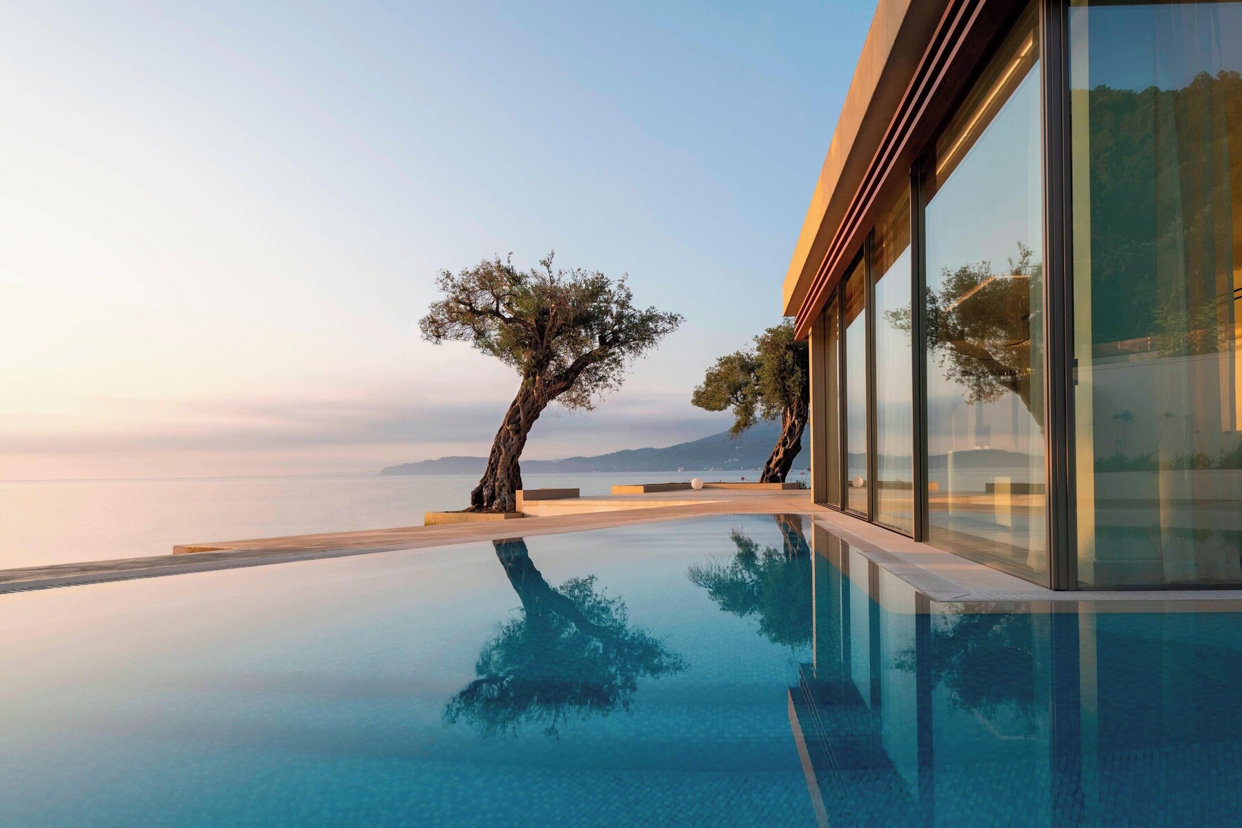Indoor pool, seasonal outdoor pool, pool umbrellas, sun loungers