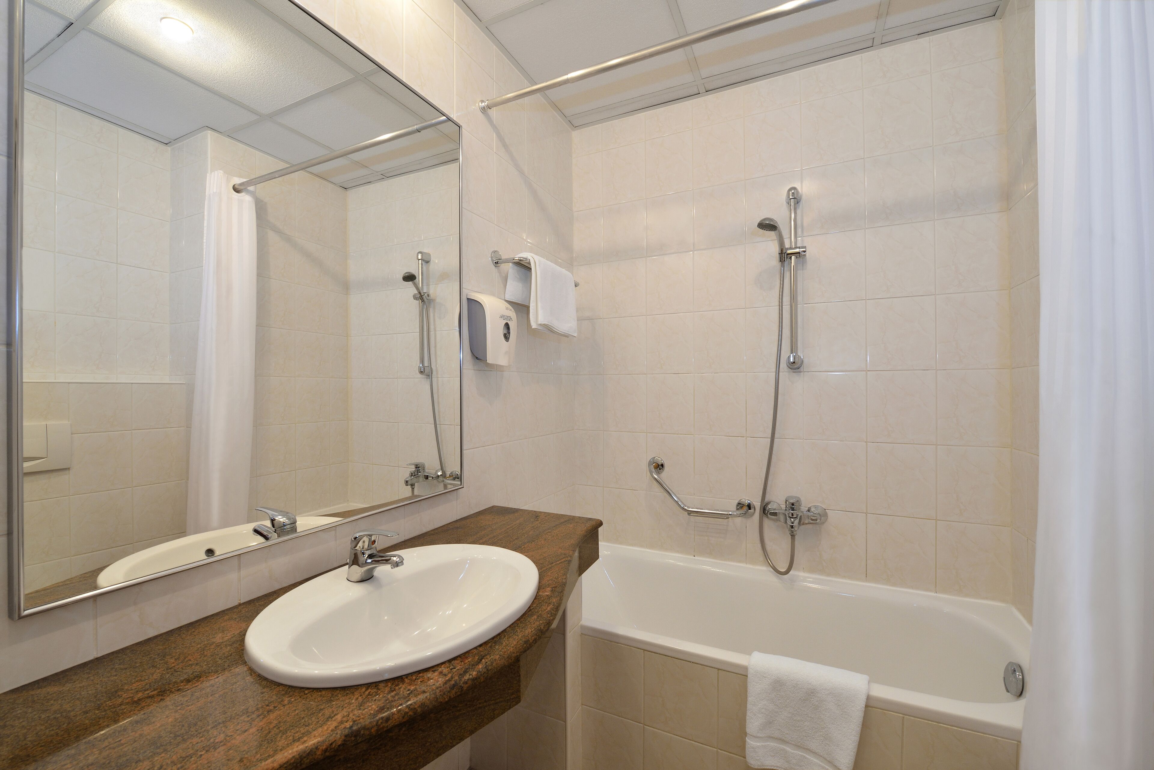 bathtub, hair dryer, towels