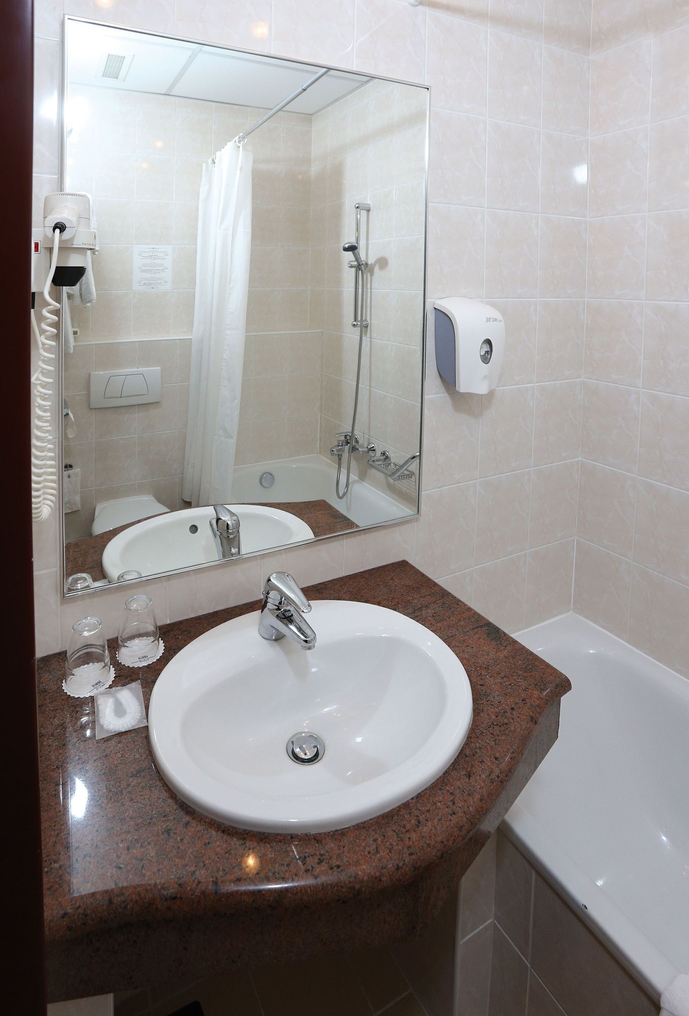 bathtub, hair dryer, towels