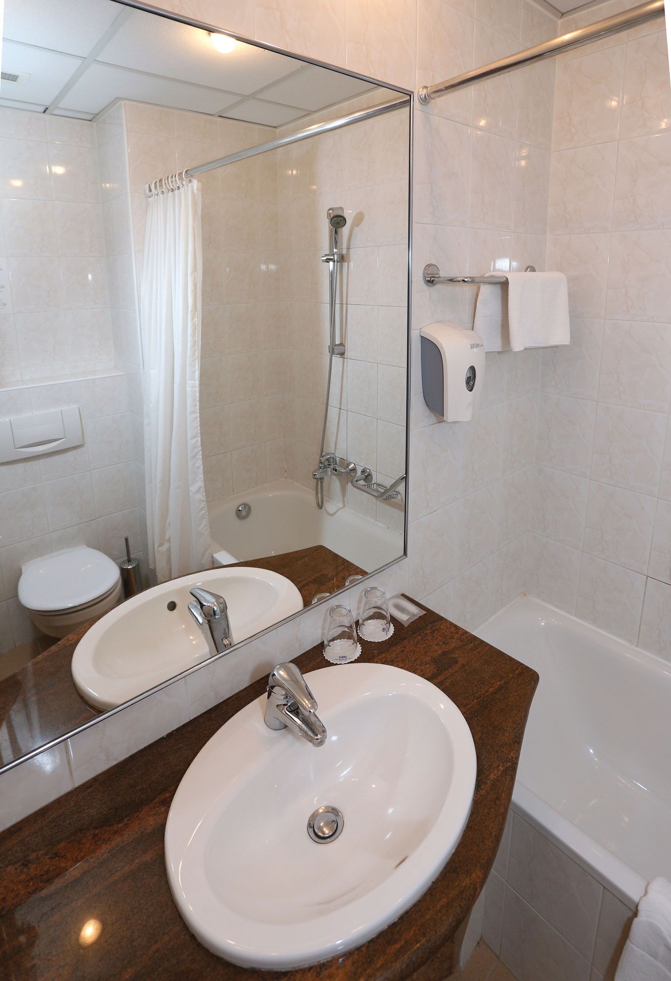 bathtub, hair dryer, towels