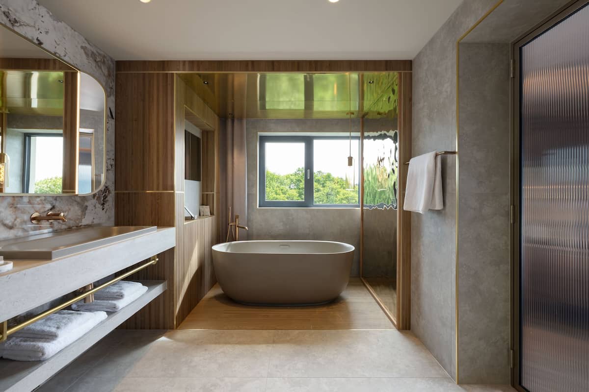 the hans liebherr suite | bathroom | free toiletries, hair dryer, bathrobes, slippers