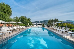 Seasonal outdoor pool, pool umbrellas, pool loungers