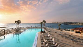 Indoor pool, outdoor pool, pool umbrellas, pool loungers