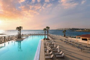 Indoor pool, outdoor pool, pool umbrellas, pool loungers