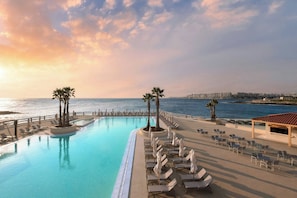 Indoor pool, outdoor pool, pool umbrellas, pool loungers