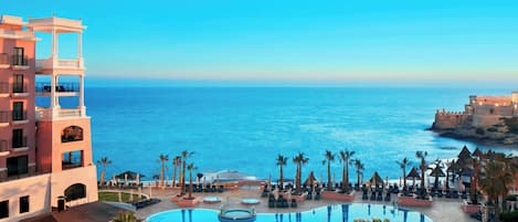 Indoor pool, outdoor pool, pool umbrellas, sun loungers