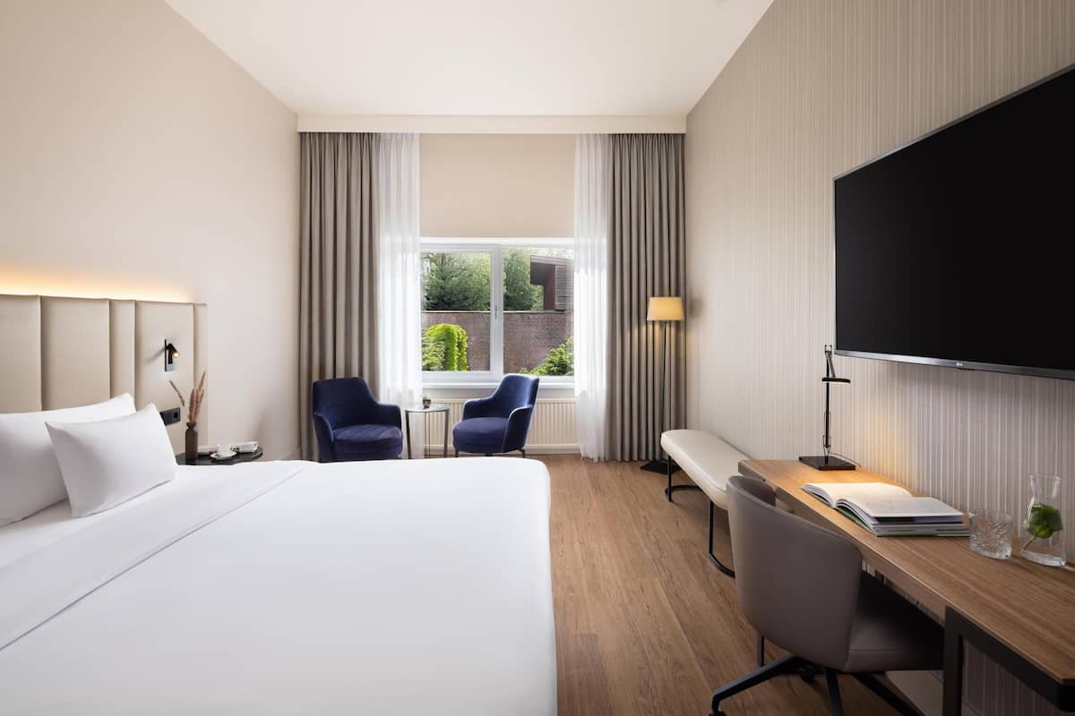 Superior Room (Courtyard) | Minibar, in-room safe, desk, blackout drapes