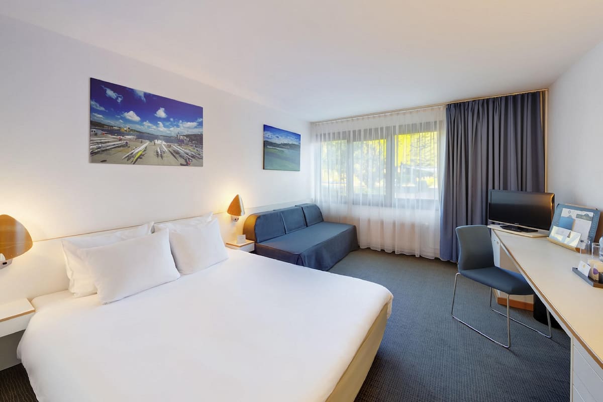 Desk, blackout curtains, free cots/infant beds, free WiFi