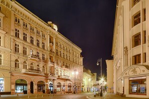 A historic building with ornate architecture, large windows, and a prominent entrance.