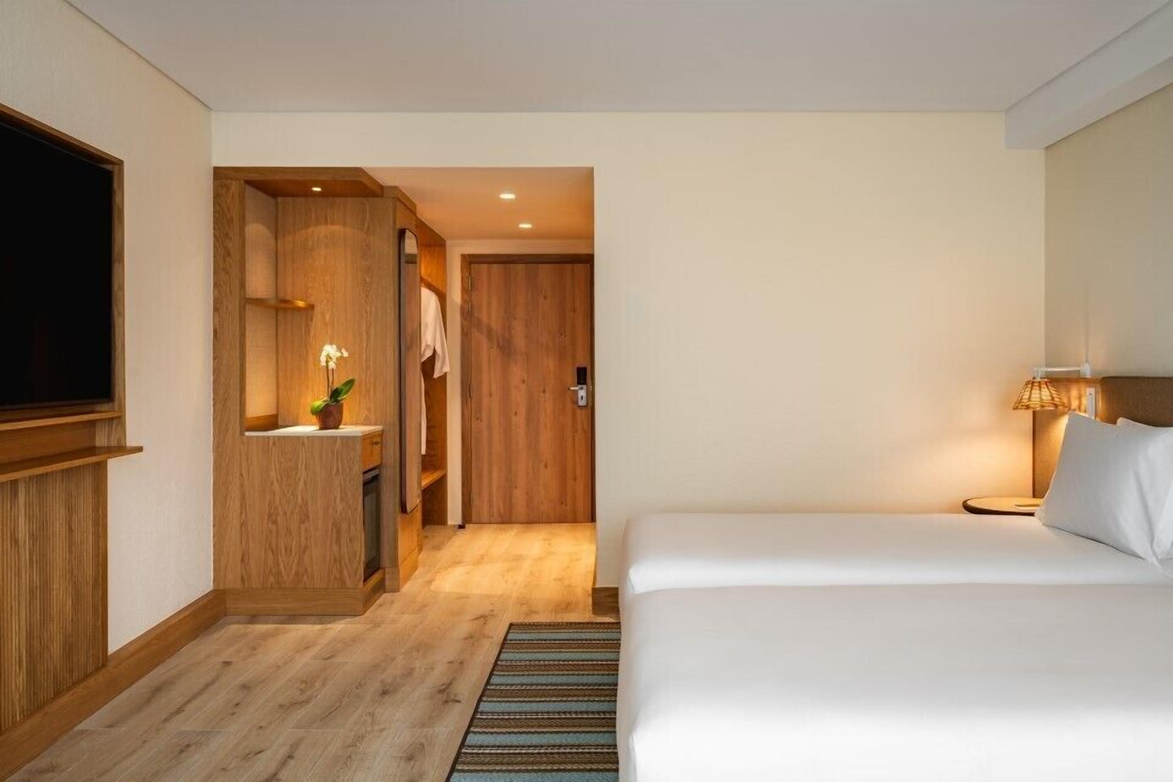 Chambre, 2 lits une place | Minibar, coffres-forts dans les chambres, bureau, rideaux occultants