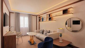 A hotel room with a sofa, a desk, a chair, a round mirror, and shelves with decorative items.