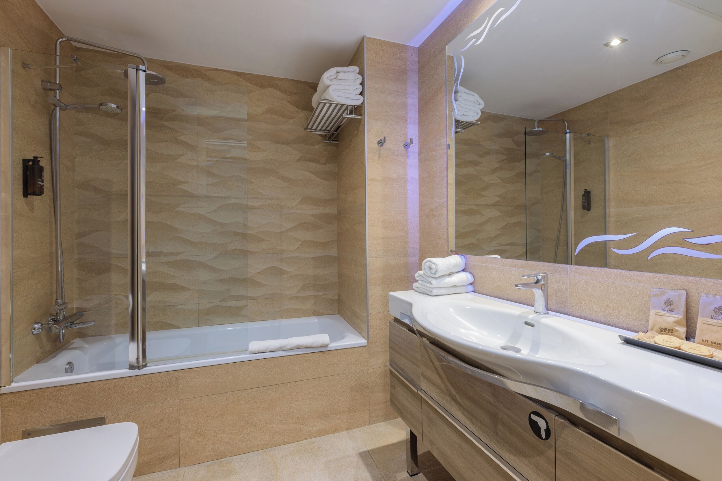 eco-friendly toiletries, hair dryer, towels, soap